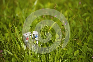 Tv remote control on grass