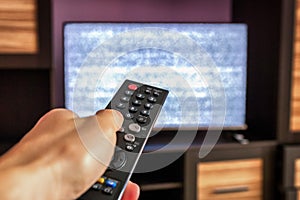 TV remote control, interference on  screen television set photo