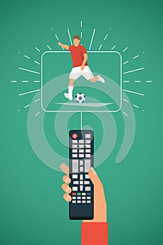 TV remote in hand. Football / Soccer player kick on ball. Sport broadcasting theme.