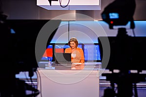 TV reporter at the news desk