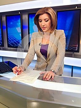 TV reporter at the news desk