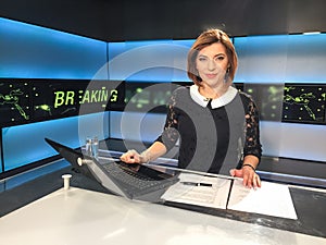 TV reporter at the news desk