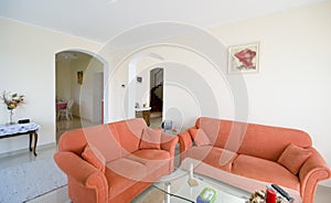 TV room with orange sofas photo