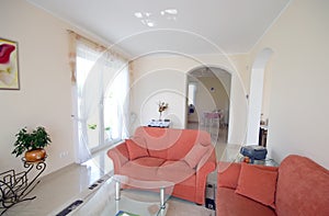 TV room with orange sofas photo