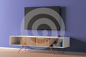 TV screen on the blue wall in modern living room