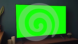 TV screen mockup background. Lcd tv monitor with blank green screen in living room while watching