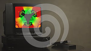 TV shows abstract pictures. TV shows a zombie video on the monitor. TV shows video hypnotizing consciousness