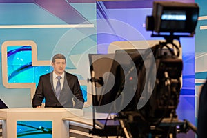 Tv studio camera recording male reporter or anchorman. Live broadcasting