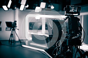 TV Studio live broadcasting.Recording show.TV NEWS program studio with video camera lens and lights photo