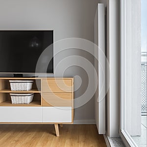 Tv on stylish wooden cabinet