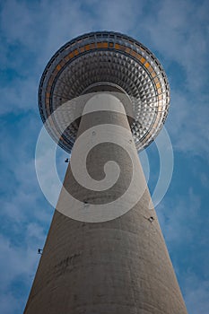 Tv tower in Berlin, on Alexanderplatz square on a clear spring day. Prominent tall building in Berlin, Germany. Looking directly