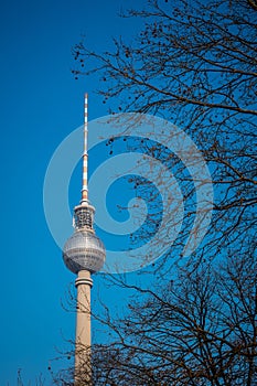 Tv tower in Berlin, on Alexanderplatz square on a clear spring day. Prominent tall building in Berlin, Germany. Looking from side