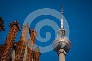 Tv tower in Berlin, on Alexanderplatz square on a clear spring day. Prominent tall building in Berlin, Germany. Looking from side