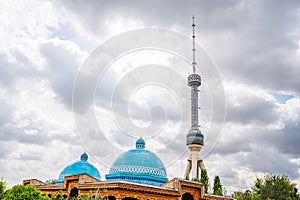 TV tower and domes of the Museum of memory of victims of political repression in Tashkent in Uzbekistan photo
