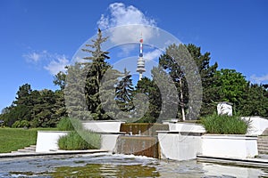 Tv tower  Donauturm and fountain in Donaupark photo