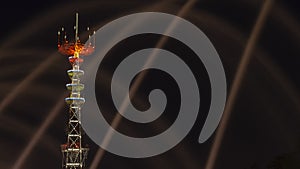 TV Tower in festival illumination. On foreground fountain with long exposure water drop. Festive concept.