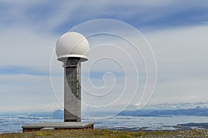 TV tower on GullsvÃ¥gfjellet Mountain top on Vega island against the background of the Norwegian sea
