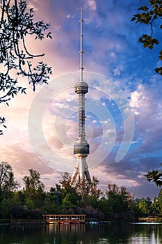 TV tower in Tashkent in Uzbekistan with water of river under a blue sky in summer