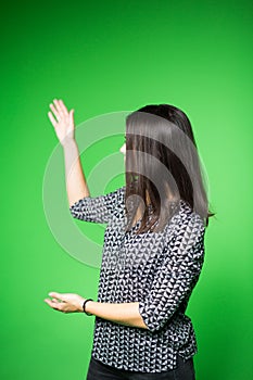 TV weather news reporter at work.News anchor presenting the world weather report.Television presenter recording in a green screen