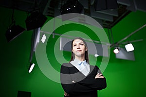 TV weather news reporter at work.News anchor presenting the world weather report.Television presenter recording in a green screen photo