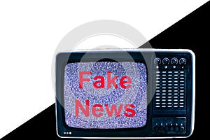 TV on white and black background interference and the inscription fake news