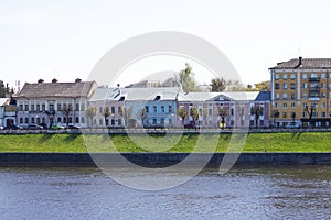 TVER, Russia, May 2021: View of the Stepan Razin Embankment on the Volga river in Tver. Old buildings on the embankment of Stepan