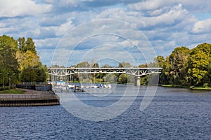 Tvertsa river flows into the Volga river in Tver, Russia. Road bridge over the river and the city pier