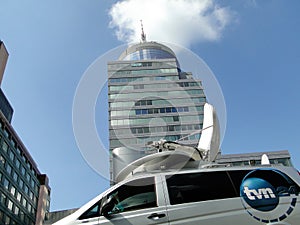 TVN 24 TV car van in front of skyscraper in Szczecin - Pazim Radisson
