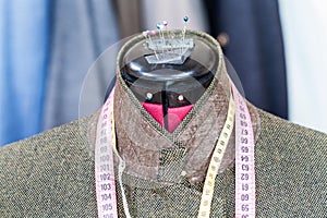 Tweed jacket on mannequin and ready suits