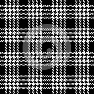 Tweed plaid pattern in black and white. Seamless textured hounds tooth check plaid graphic art for jacket, coat, skirt.