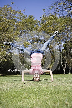 Tween Girl doing Headstand