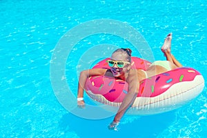 Tween girl in resort pool