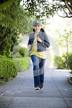 Tween Girl Running on sidewalk