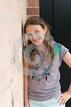 Tween girl smiling to camera