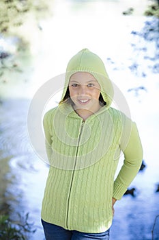 Tween Girl standing by Lake