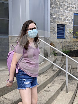 Tween Girl Wearing Surgical Mask Leaving School