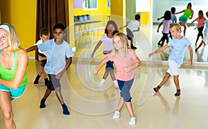 Tweens exercising in choreography class photo