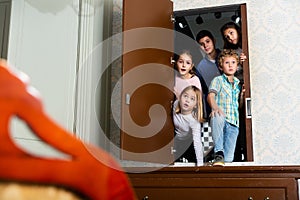 Tweens peeking into quest room through open door