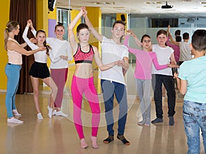 Tweens practicing jive in dance class photo