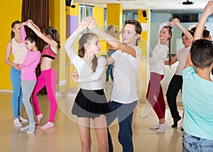 Tweens practicing vigorous dance in class