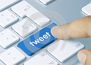 Tweet - Inscription on Blue Keyboard Key