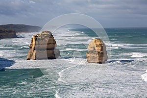 Twelve Apostles rock formation during a winter time with long waves in the ocean, Victoria, Australia