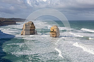 Twelve Apostles rock formation during a winter time with long waves in the ocean, Victoria, Australia