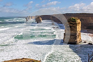 Twelve Apostles rock formation during a winter time with long waves in the ocean, Victoria, Australia