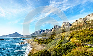 The Twelve Apostles, which is the ocean side of Table Mountain, The beach community of Camps Bay and Lions Head mountain