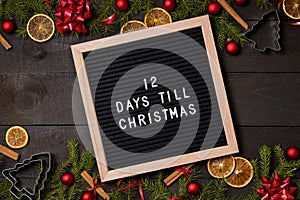 Twelve Days till Christmas countdown letter board on dark rustic wood
