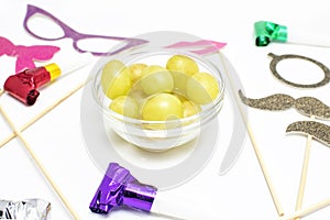 Twelve grapes and utensils for New Year photo