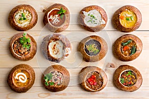 Twelve Soup Varieties Served in Bread Bowls