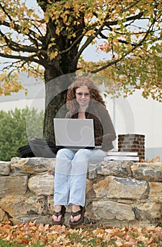 Twenties redhead studying outdoors