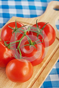 Twig red tomatoes cutting board